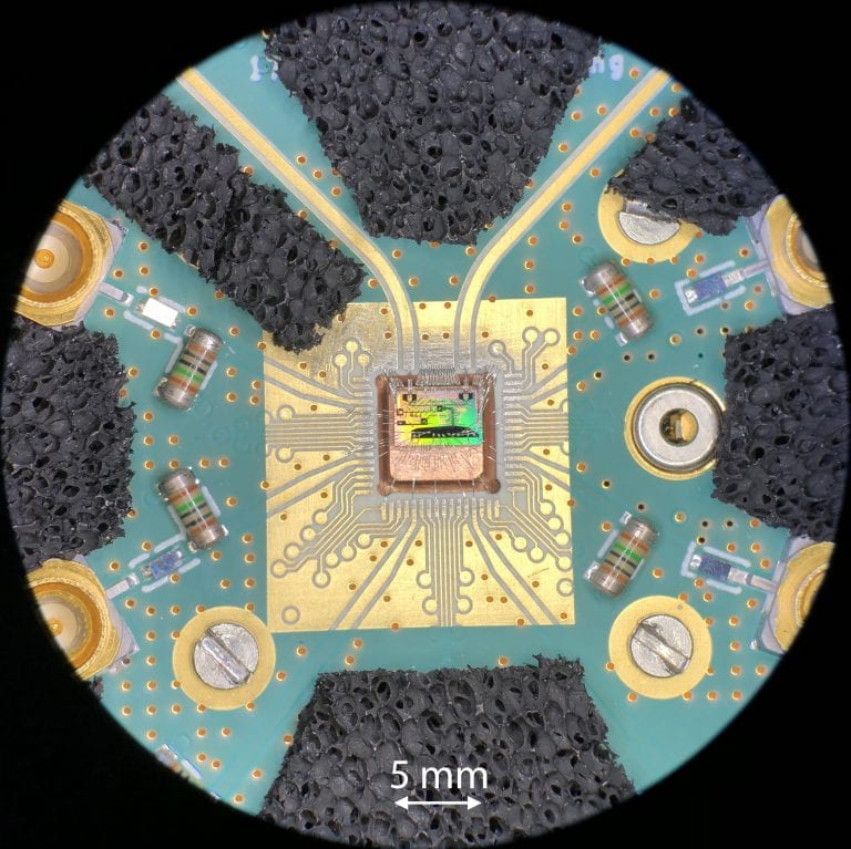 Photo by an optical microscope of the quantum chip connected to a circuit board